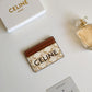 CELINE CARD HOLDER IN TRIOMPHE CANVAS WITH CELINE PRINT WHITE TAN 10CM 10B702CLY 01TA