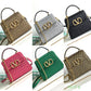 VO VLOGO TOP HANDLE BAG GREY 22CM