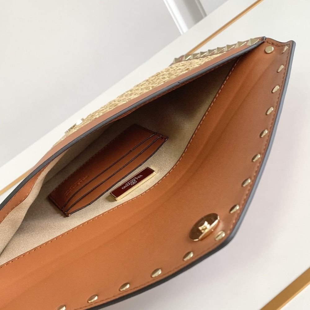 VO GARAVANI ROCKSTUD RAFFIA CLUTCH BAG IN BROWN 28CM