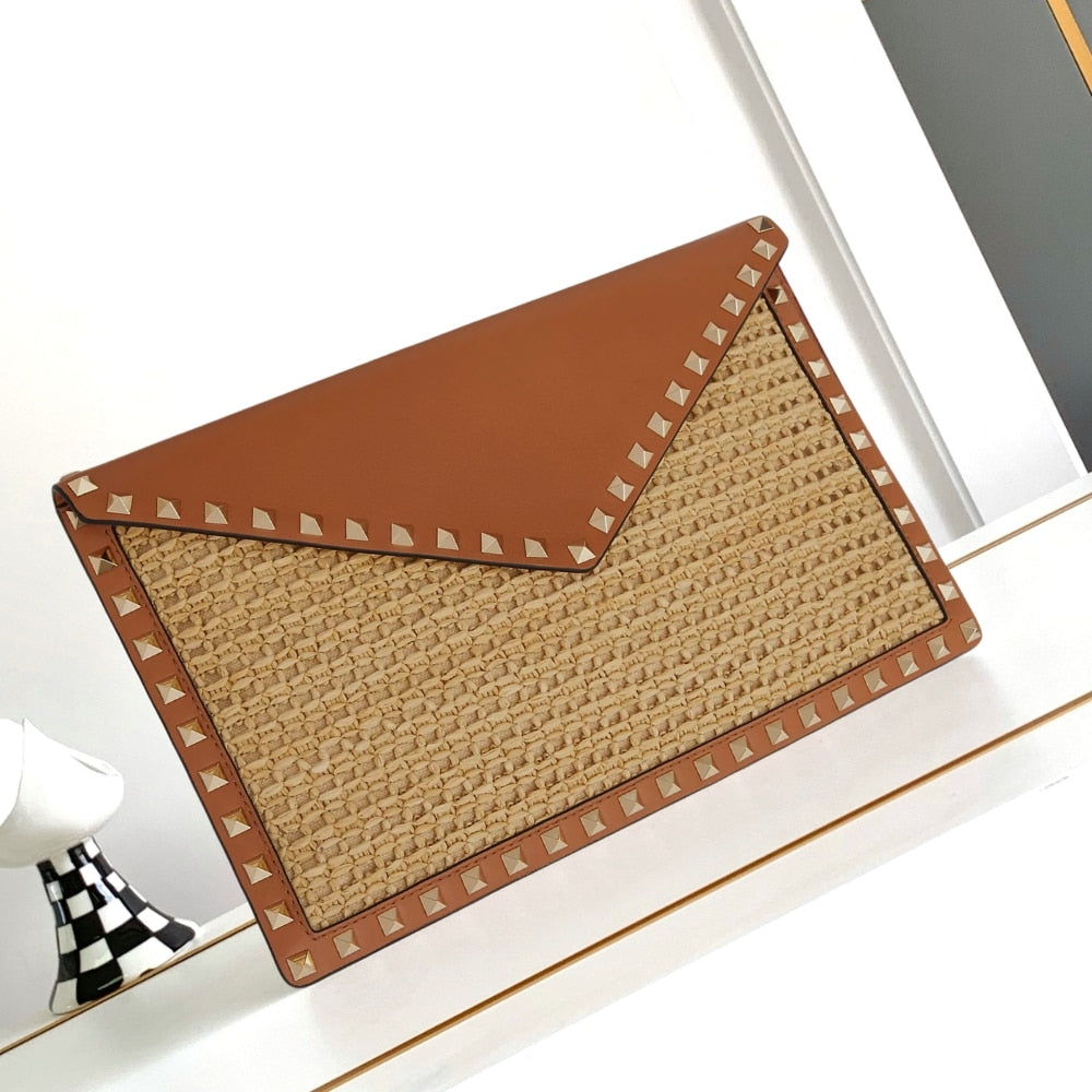 VO GARAVANI ROCKSTUD RAFFIA CLUTCH BAG IN BROWN 28CM