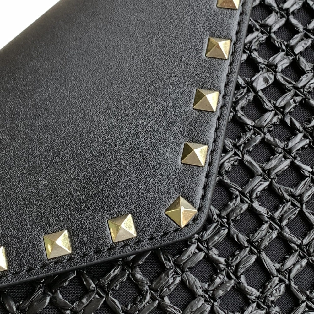 VO GARAVANI ROCKSTUD RAFFIA CLUTCH BAG IN BLACK 28CM