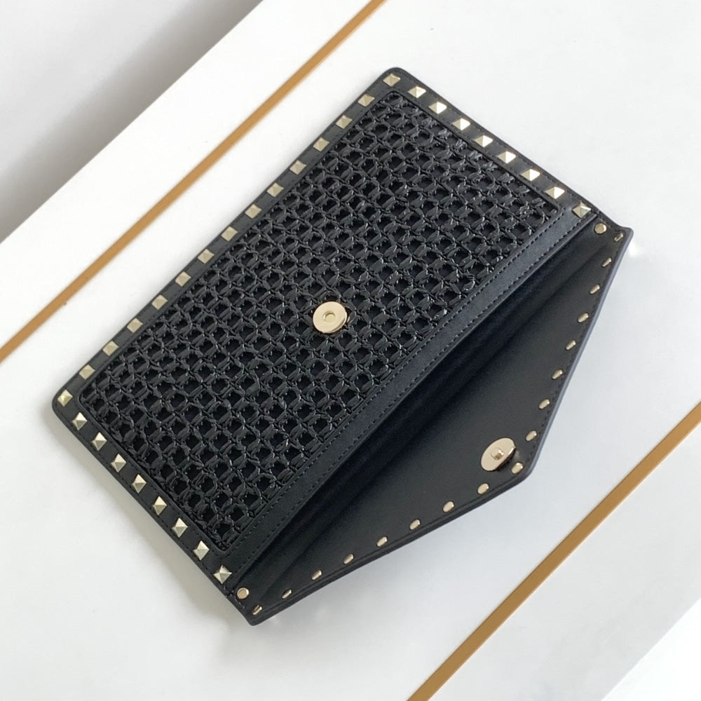 VO GARAVANI ROCKSTUD RAFFIA CLUTCH BAG IN BLACK 28CM