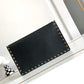 VO GARAVANI ROCKSTUD RAFFIA CLUTCH BAG IN BLACK 28CM