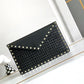 VO GARAVANI ROCKSTUD RAFFIA CLUTCH BAG IN BLACK 28CM