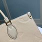 M45595 OnTheGo MM Monogram Empreinte leather white 35cm